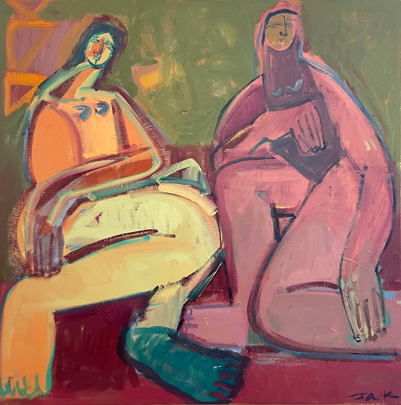 Two women on a red blanket